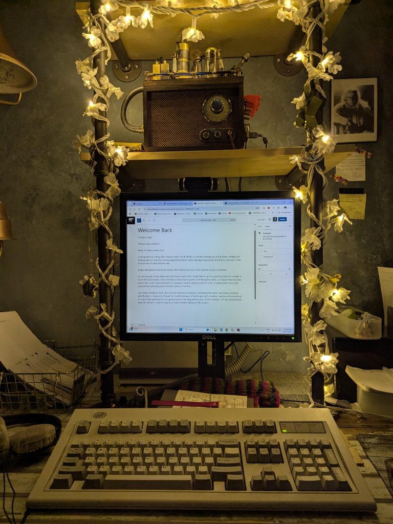 My writing desk, featuring both my vintage model-M keyboard and my homemade writing computer, M.I.D.G.E.